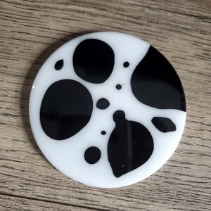 Cowhide print epoxy resin coaster.